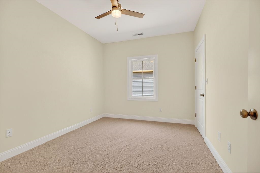 1303 East Main Street Waynesboro, VA 22980 - Photo 31 of 38 an empty room with a empty space and a ceiling fan