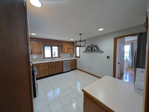 a view of a kitchen cabinets and wooden floor