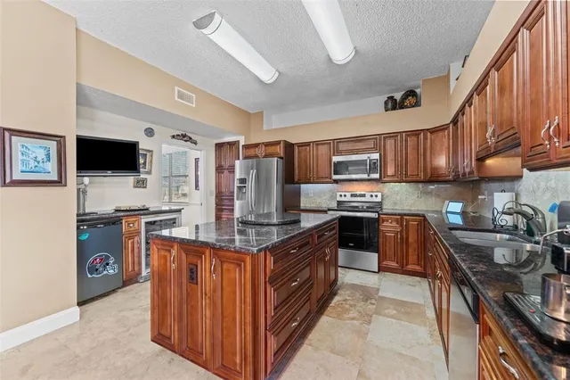 a kitchen with granite countertop lots of counter top space