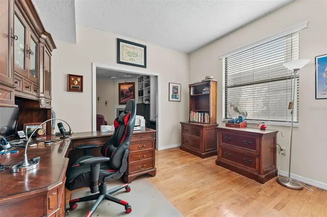 a view of hallway with wooden floor