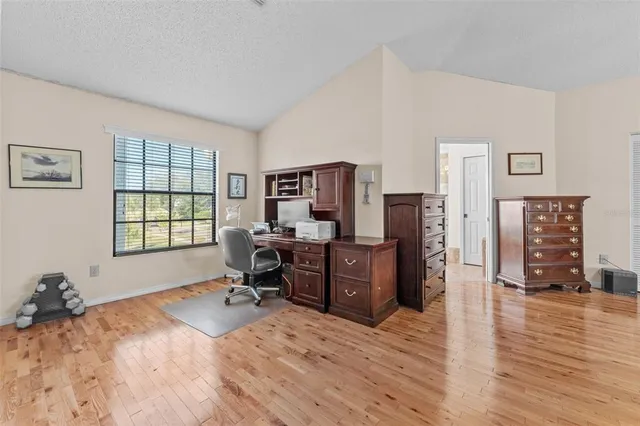a bathroom with bathtub and window