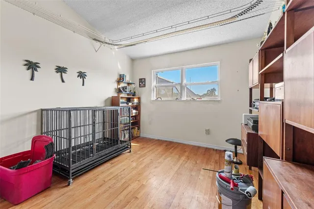 a bedroom with bed and window