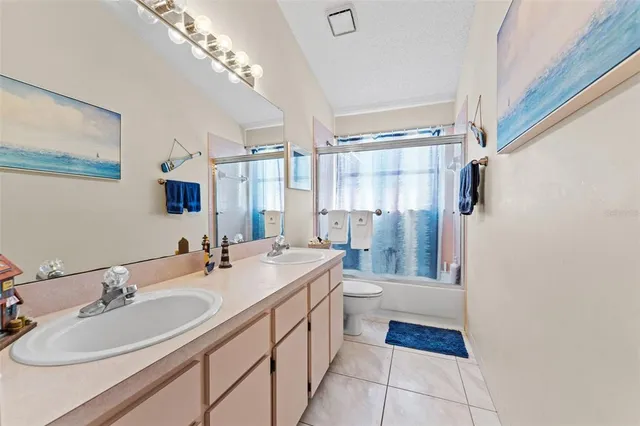 a bedroom with a bed and a desk