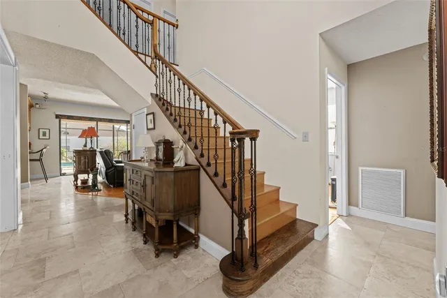 a living room with furniture and a piano