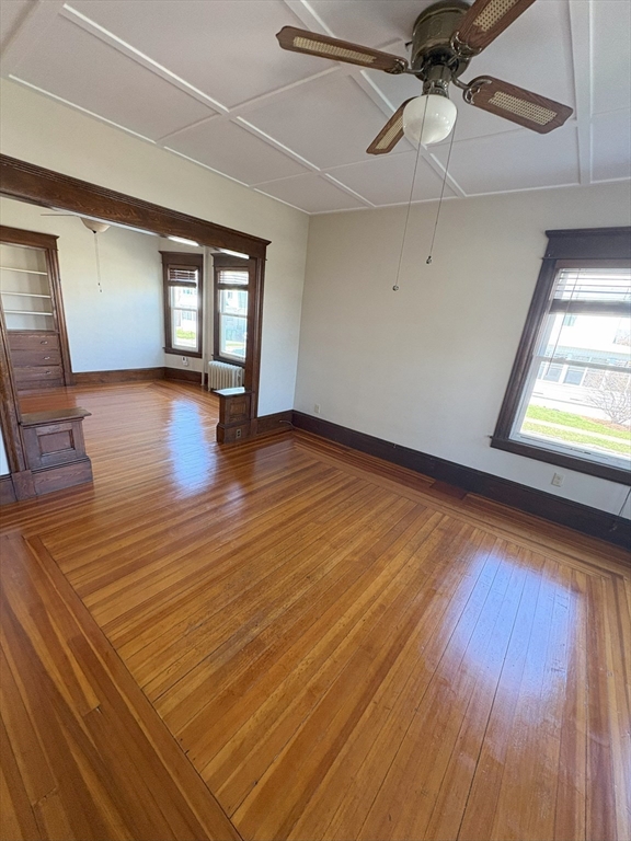 356 Springfield Street, Unit 1 Chicopee, MA 01013 - Photo 3 of 10 wooden floor in an empty room with a window