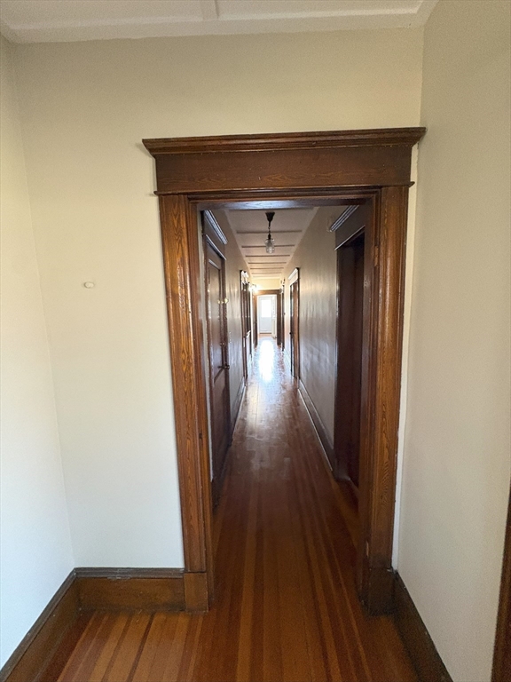 356 Springfield Street, Unit 1 Chicopee, MA 01013 - Photo 6 of 10 a view of a hallway with wooden floor