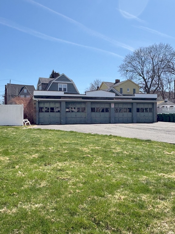 356 Springfield Street, Unit 1 Chicopee, MA 01013 - Photo 10 of 10 a view of a large building with a big yard and a large tree