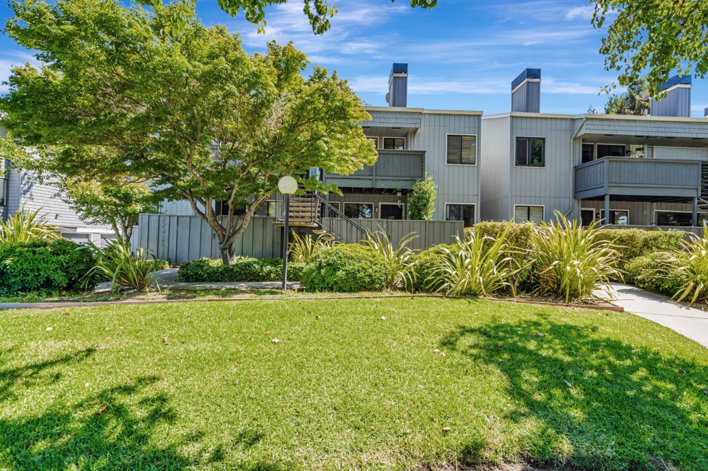 4020 Williams Road, Unit 8 San Jose, CA 95117 - Photo 1 of 1 a front view of a house with a yard