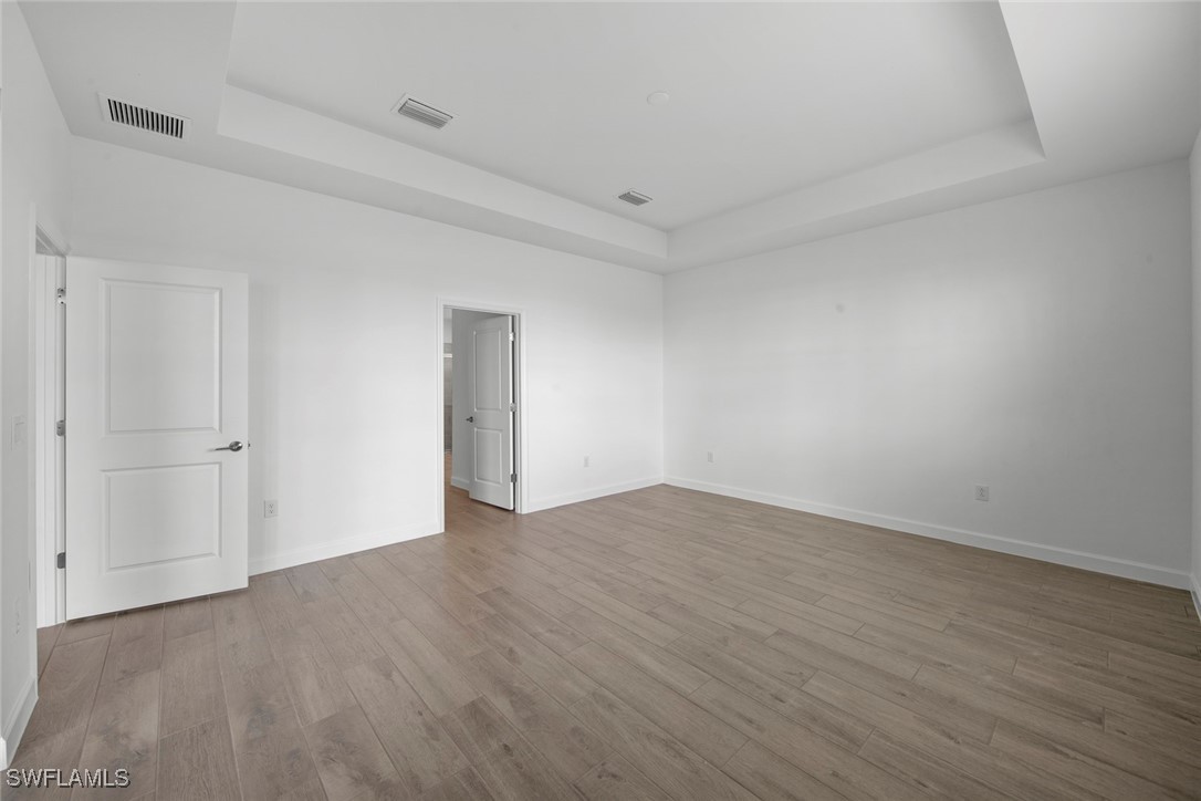 20446 Napa Loop Estero, FL 33928 - Photo 26 of 42 a view of an empty room with wooden floor