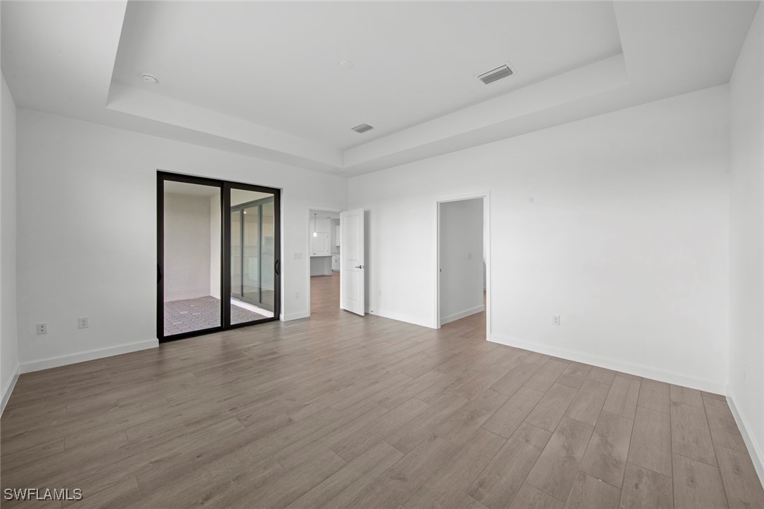 20446 Napa Loop Estero, FL 33928 - Photo 27 of 42 a view of an empty room with wooden floor and closet