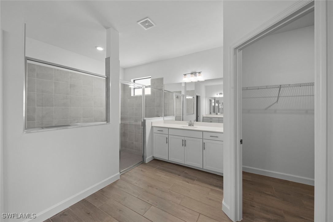 20446 Napa Loop Estero, FL 33928 - Photo 29 of 42 a bathroom with a double vanity sink and mirror