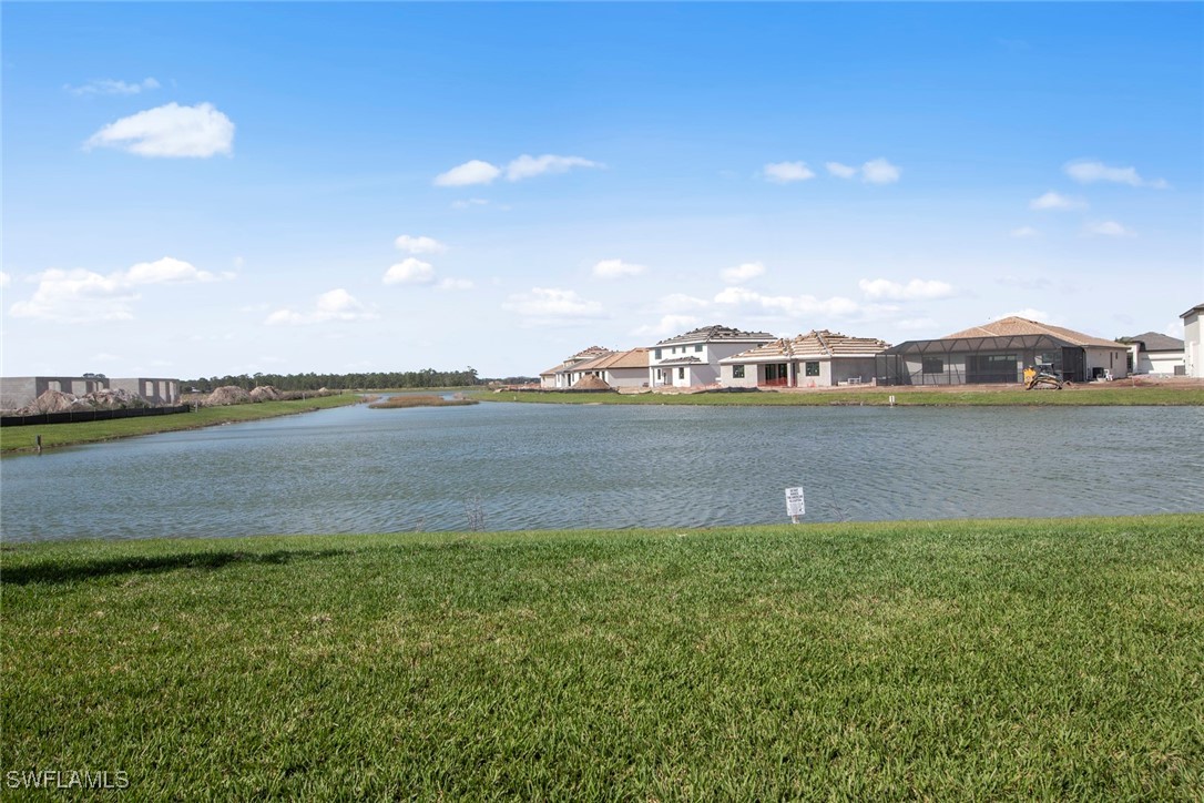 20446 Napa Loop Estero, FL 33928 - Photo 37 of 42 a view of a lake with houses in the background