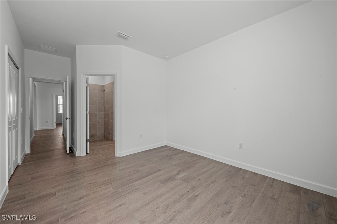 20446 Napa Loop Estero, FL 33928 - Photo 40 of 42 wooden floor in an empty room