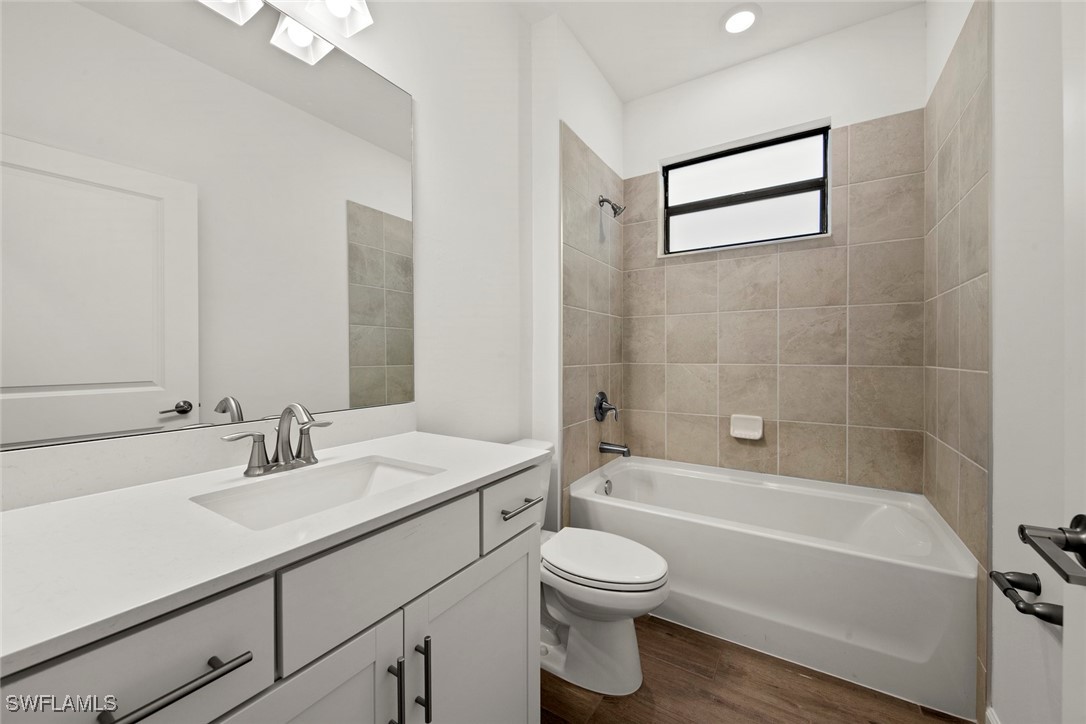 20446 Napa Loop Estero, FL 33928 - Photo 8 of 42 a bathroom with a sink a toilet and bathtub