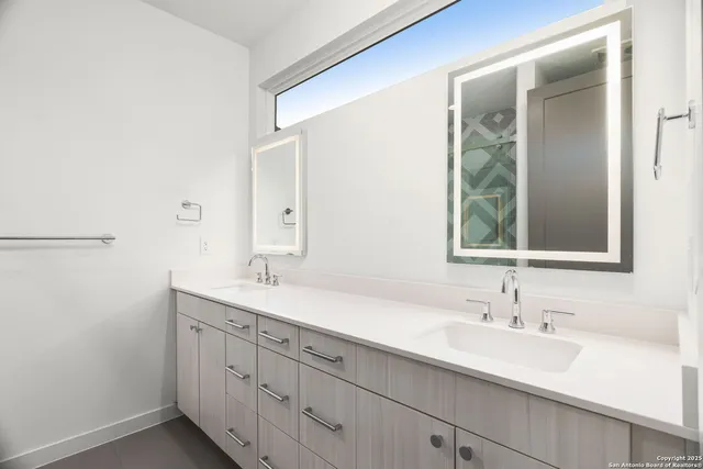 a bathroom with a sink and a mirror