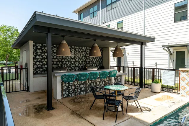 a view of a chairs and table in the patio