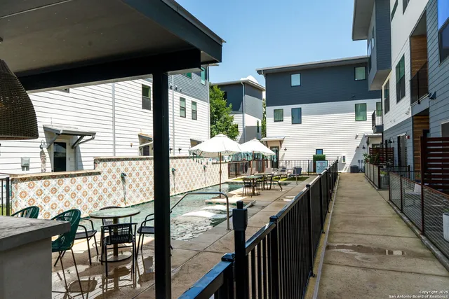 a view of a patio with swimming pool