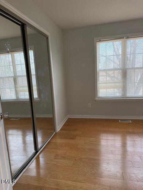 2036 Turtle Point Drive Raleigh, NC 27604 - Photo 24 of 27 a view of empty room with wooden floor and fan