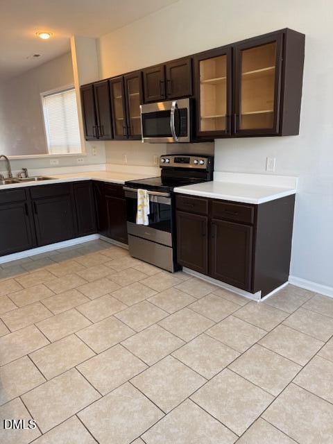 2036 Turtle Point Drive Raleigh, NC 27604 - Photo 5 of 27 a kitchen with stainless steel appliances a stove sink and cabinets