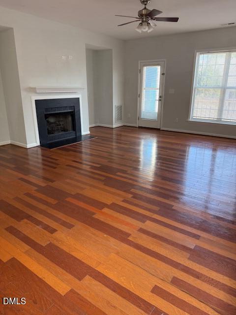 2036 Turtle Point Drive Raleigh, NC 27604 - Photo 10 of 27 a view of an empty room with wooden floor and a fireplace