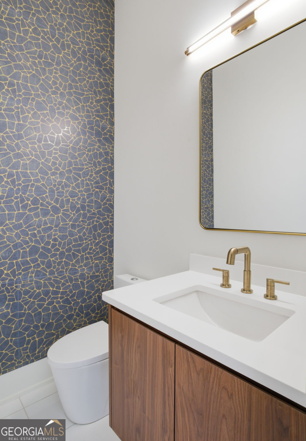 360 Campground Road McDonough, GA 30253 - Photo 25 of 34 a bathroom with a toilet sink and mirror