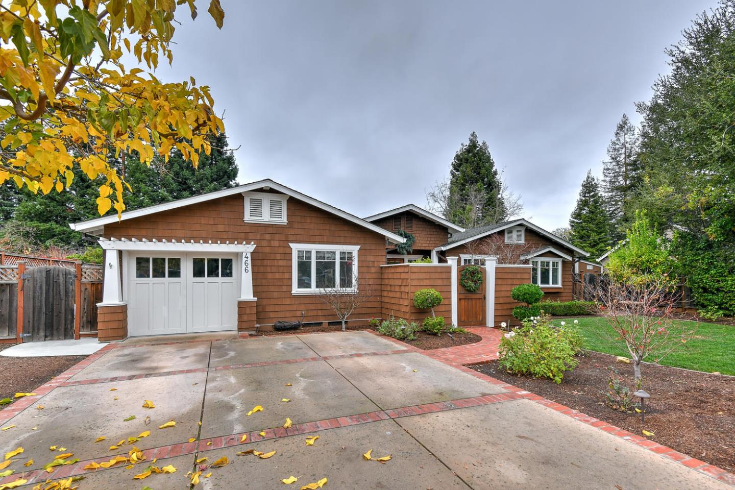 466 Springer Road Los Altos, CA 94024 - Photo 1 of 52 a view of house with a yard and potted plants