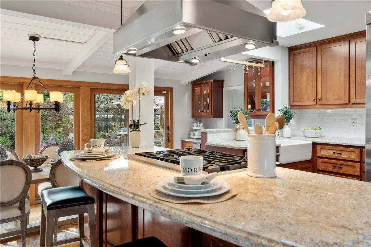 466 Springer Road Los Altos, CA 94024 - Photo 12 of 52 a dining room with furniture a chandelier and fireplace