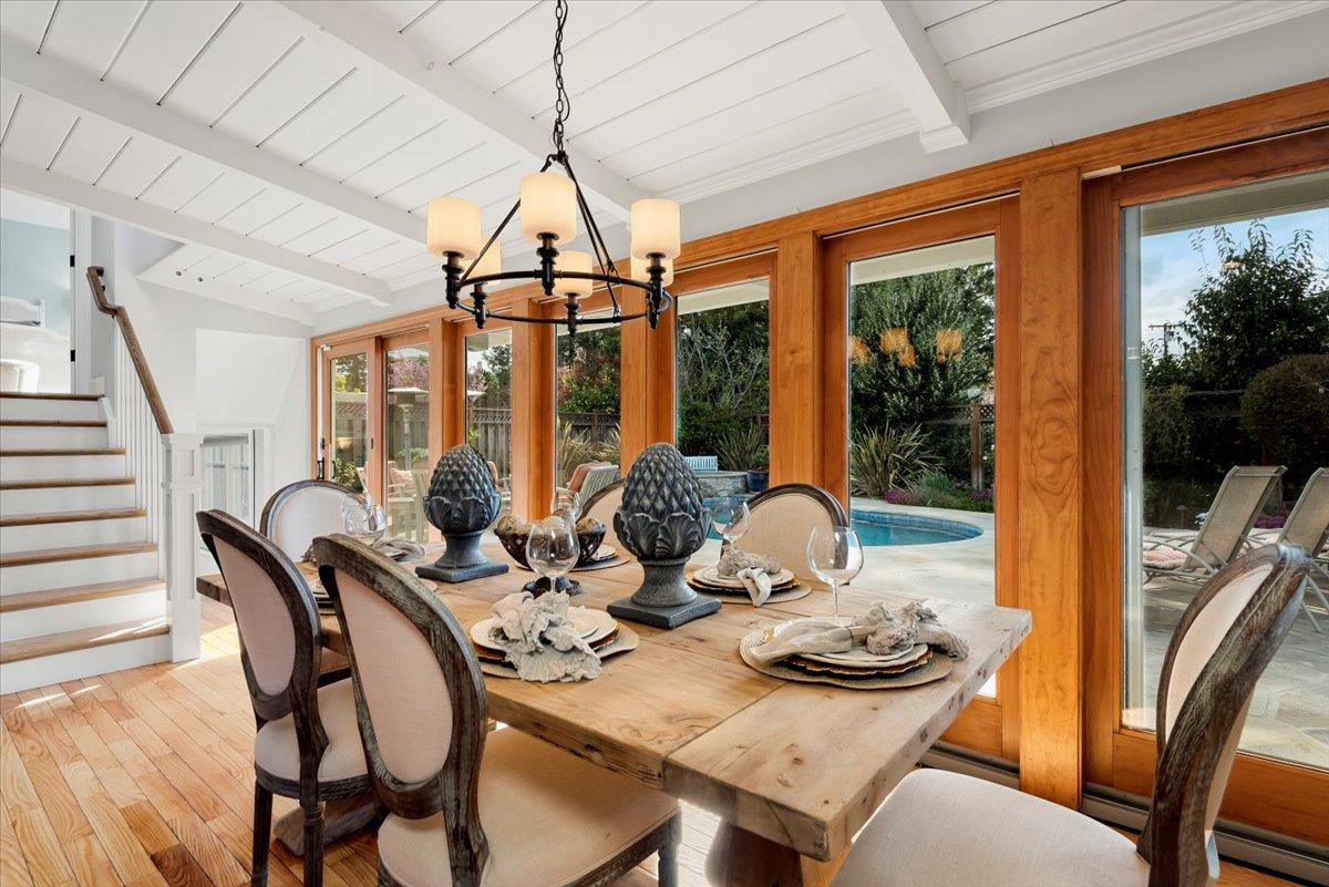 466 Springer Road Los Altos, CA 94024 - Photo 21 of 52 a view of a dining room with furniture large windows and wooden floor