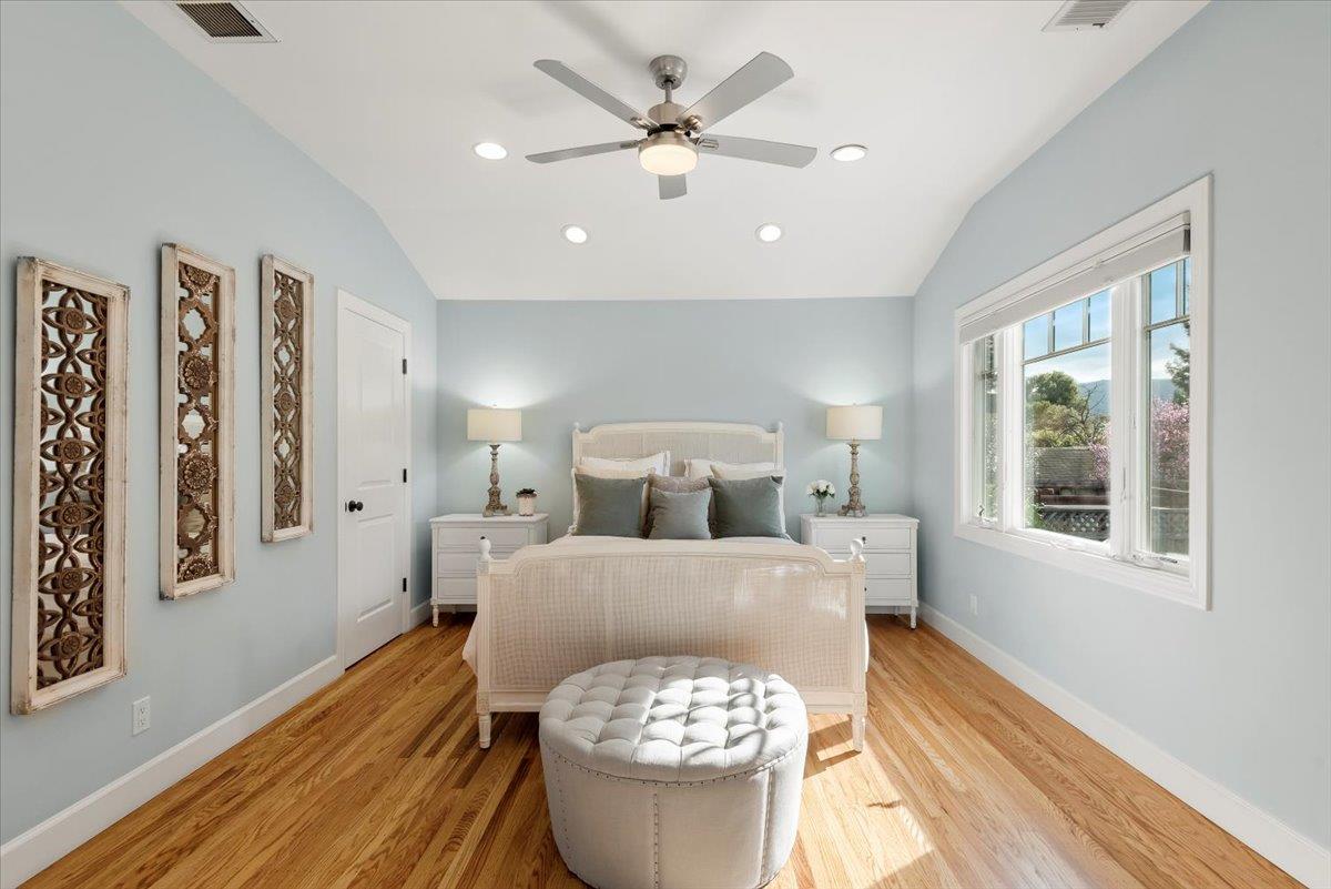 466 Springer Road Los Altos, CA 94024 - Photo 27 of 52 a bed room with a bed and a chandelier