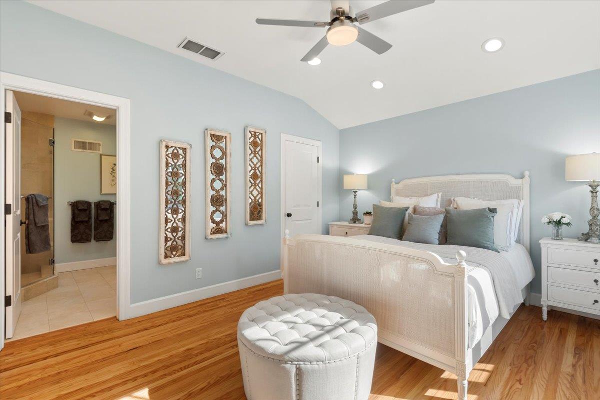 466 Springer Road Los Altos, CA 94024 - Photo 28 of 52 a bed room with a bed and a chandelier
