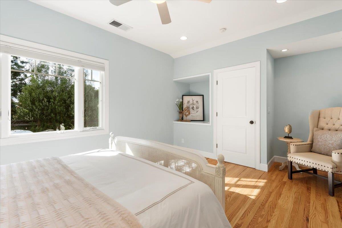 466 Springer Road Los Altos, CA 94024 - Photo 29 of 52 a bedroom with a bed and wooden floor