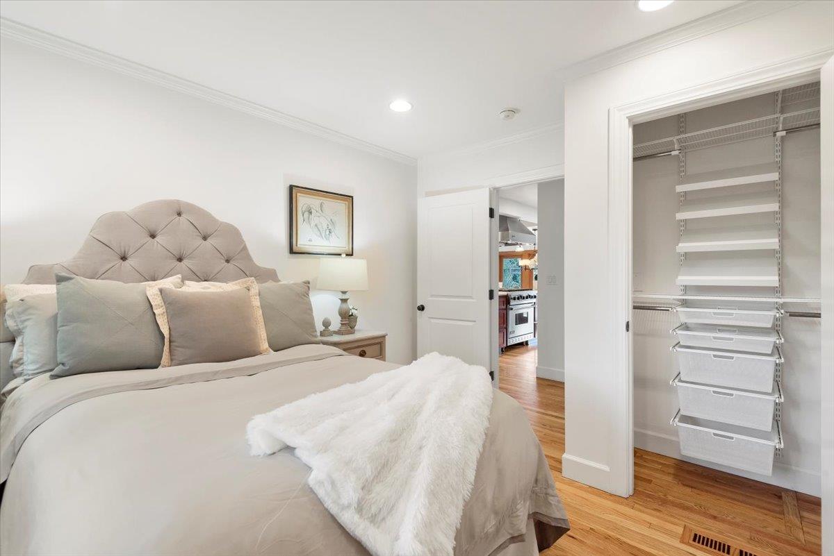 466 Springer Road Los Altos, CA 94024 - Photo 34 of 52 a bedroom with a bed and wooden floor