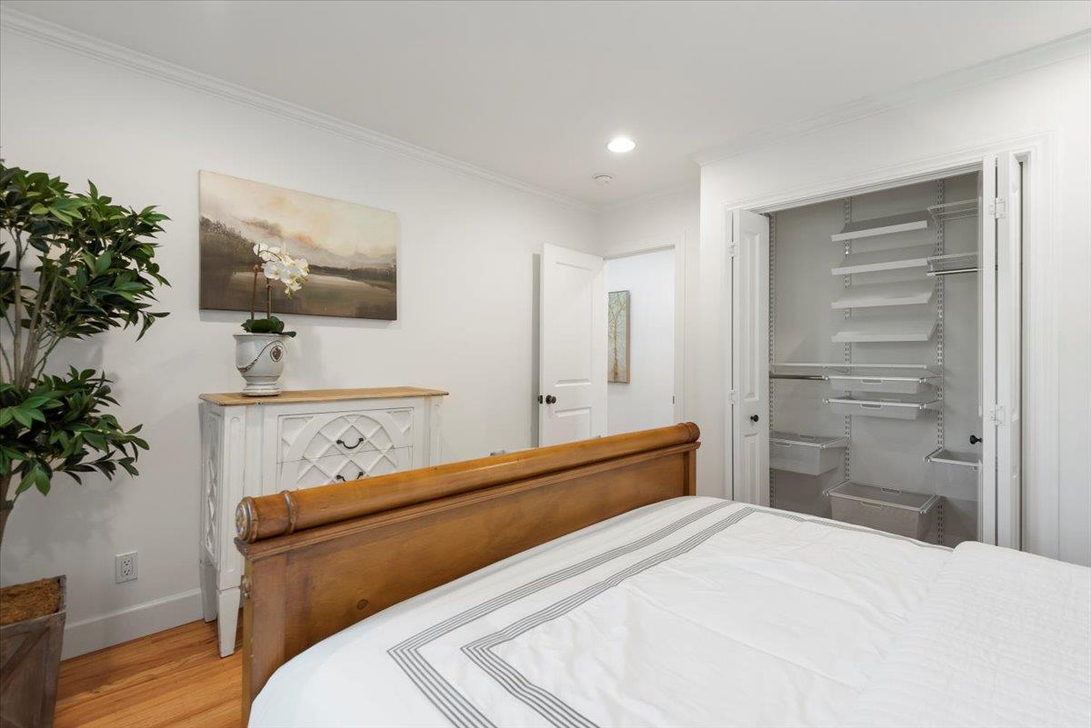 466 Springer Road Los Altos, CA 94024 - Photo 36 of 52 a bedroom with a bed and a potted plant