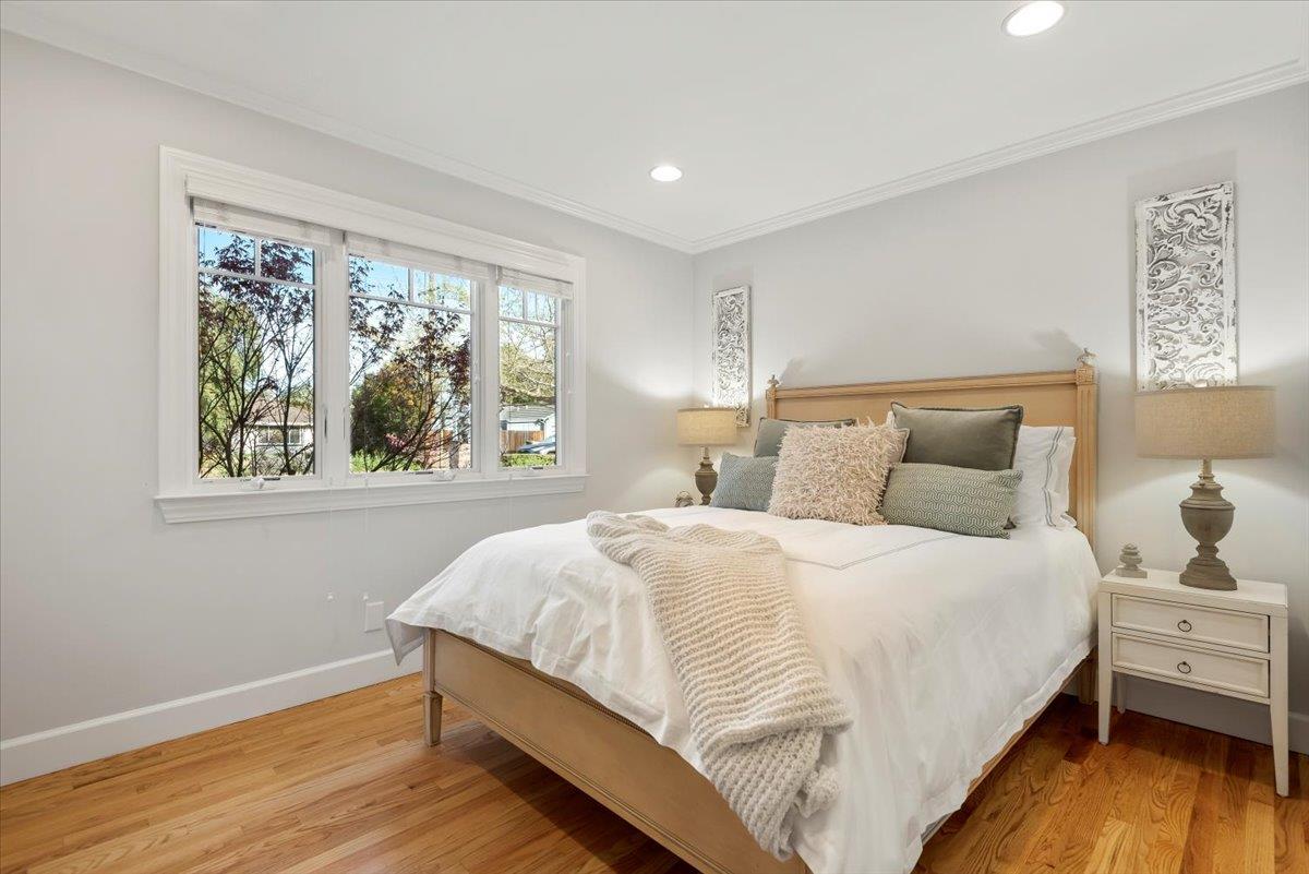 466 Springer Road Los Altos, CA 94024 - Photo 38 of 52 a bedroom with a bed and wooden floor