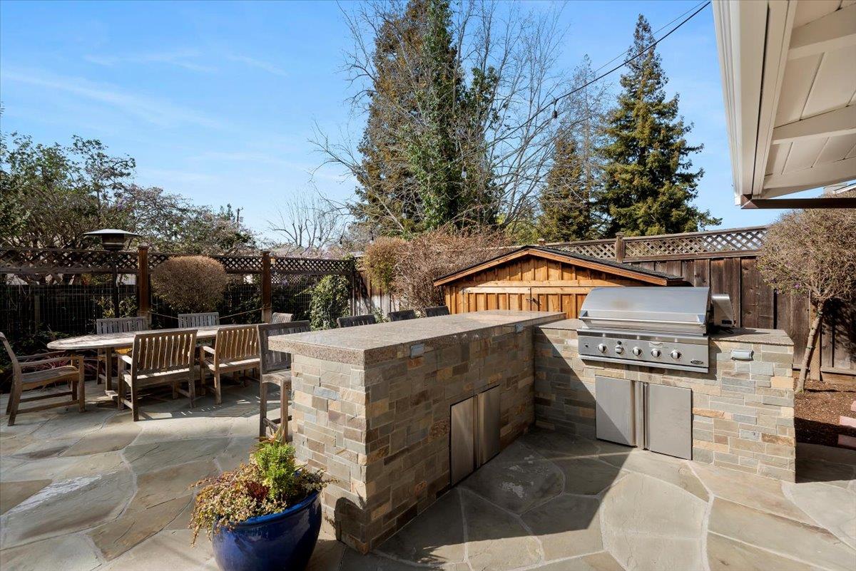 466 Springer Road Los Altos, CA 94024 - Photo 49 of 52 a view of a patio with couches table and chairs and potted plants