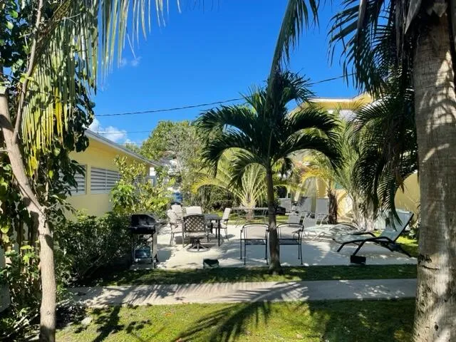 a view of swimming pool with a table and chairs