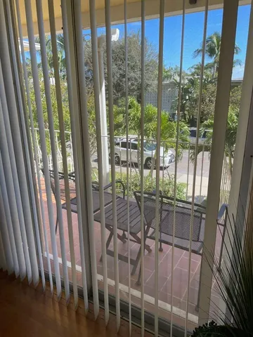 a room with balcony with furniture