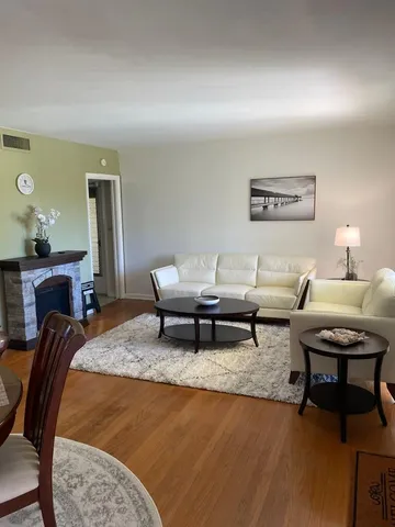 a living room with furniture and a rug