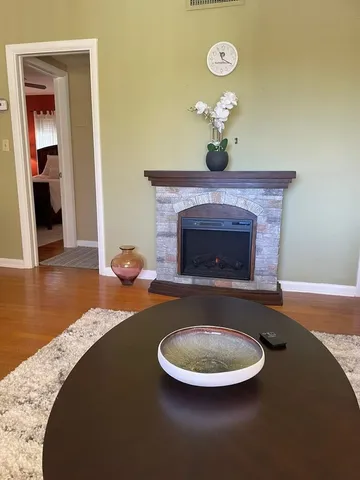 a living room with furniture and a fireplace