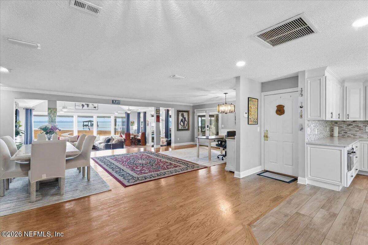 6215 West Shores Road Fleming Island, FL 32003 - Photo 13 of 103 a living room with furniture and a wooden floor