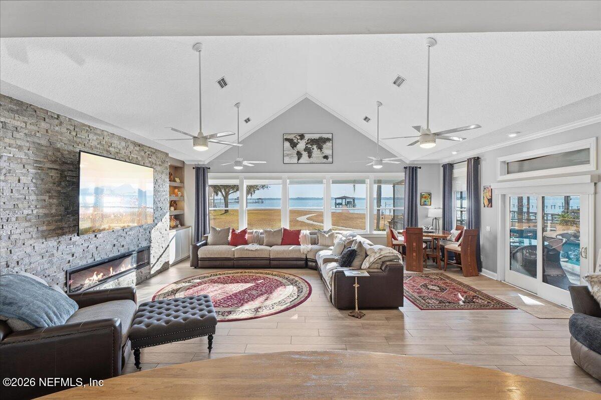 6215 West Shores Road Fleming Island, FL 32003 - Photo 16 of 103 a living room with furniture and a large window