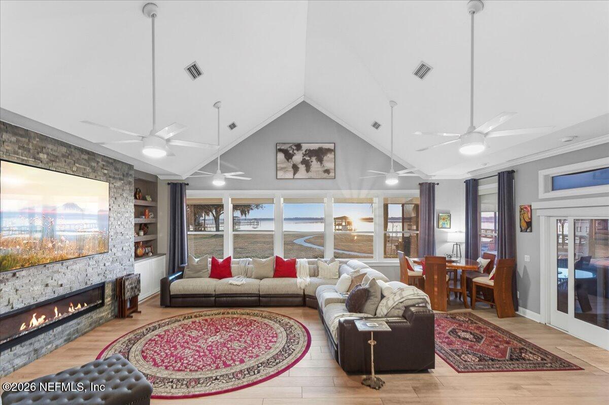 6215 West Shores Road Fleming Island, FL 32003 - Photo 17 of 103 a living room with furniture and a flat screen tv