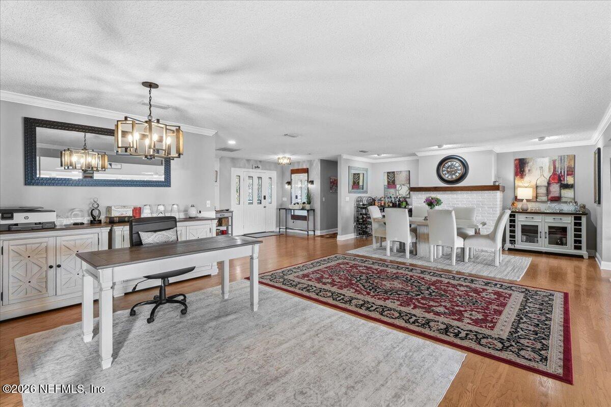 6215 West Shores Road Fleming Island, FL 32003 - Photo 28 of 103 a living room with furniture and wooden floor