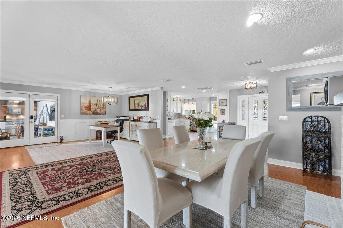 6215 West Shores Road Fleming Island, FL 32003 - Photo 30 of 103 a view of a dining room with furniture and wooden floor