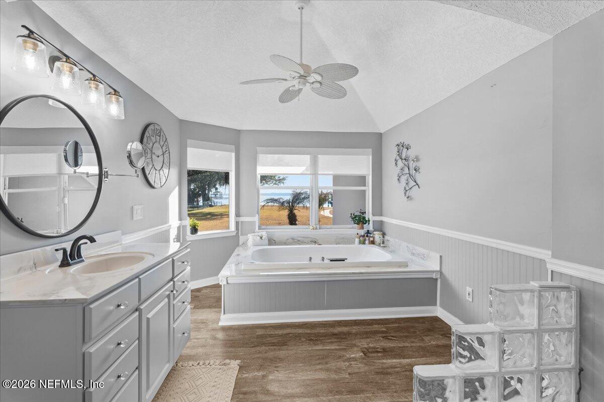 6215 West Shores Road Fleming Island, FL 32003 - Photo 34 of 103 a spacious bathroom with a sink double vanity and a mirror
