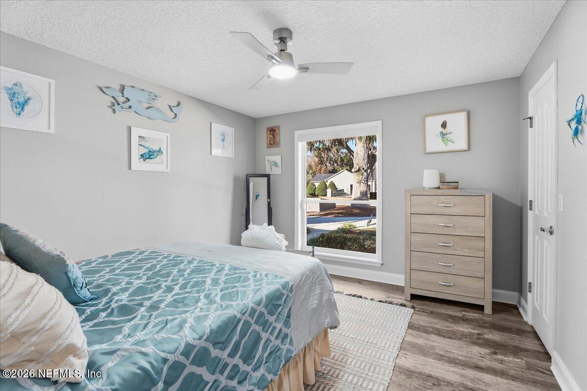 6215 West Shores Road Fleming Island, FL 32003 - Photo 36 of 103 a bedroom with a bed and a window