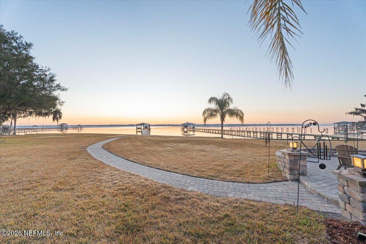 6215 West Shores Road Fleming Island, FL 32003 - Photo 59 of 103 a view of a swimming pool with a yard