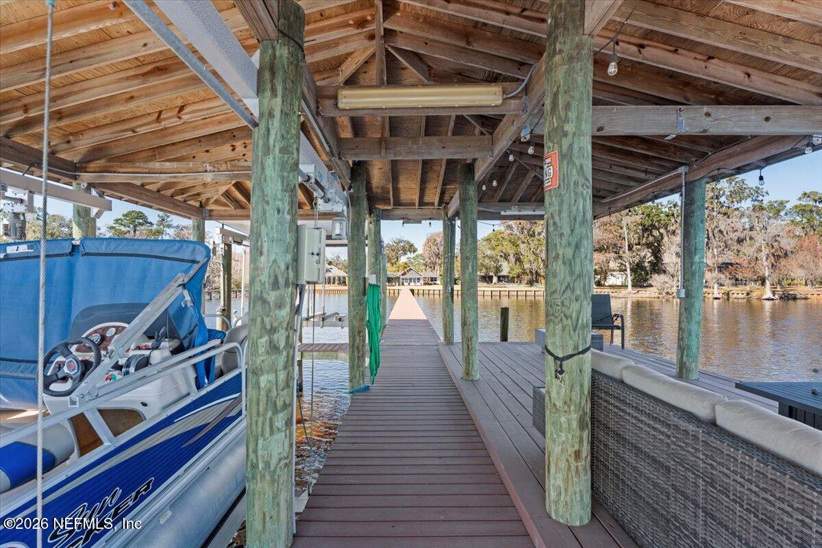 6215 West Shores Road Fleming Island, FL 32003 - Photo 66 of 103 a view of a porch with wooden floor