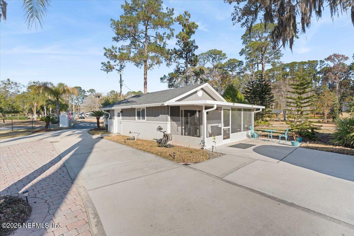 6215 West Shores Road Fleming Island, FL 32003 - Photo 76 of 103 a view of a house with a patio