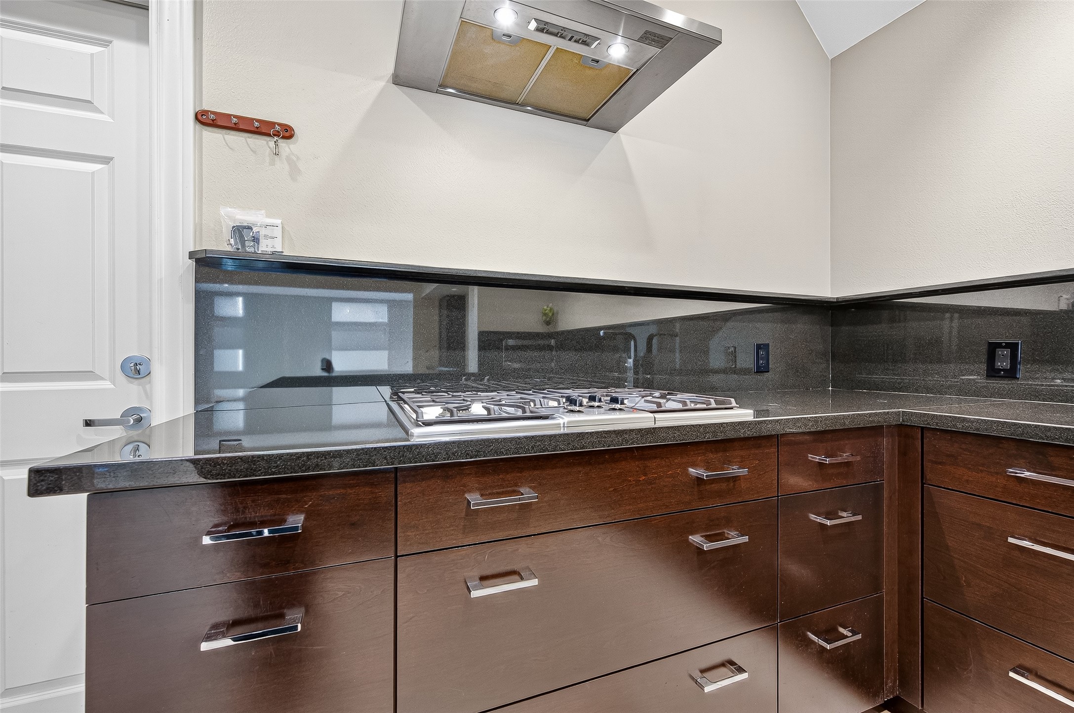3027 Bissonnet Street Houston, TX 77005 - Photo 20 of 47 Dark cabinetry and granite counters continue through every angle of this well-designed kitchen